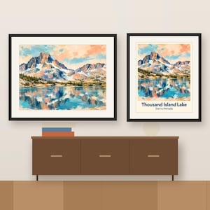 Colorful Thousand Island Lake artwork and its place-name poster, framed side by side above a wooden sideboard, shown as a room mockup
