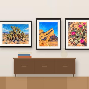 Three Desert paintings framed in a row above a wooden sideboard, shown as a room mockup
