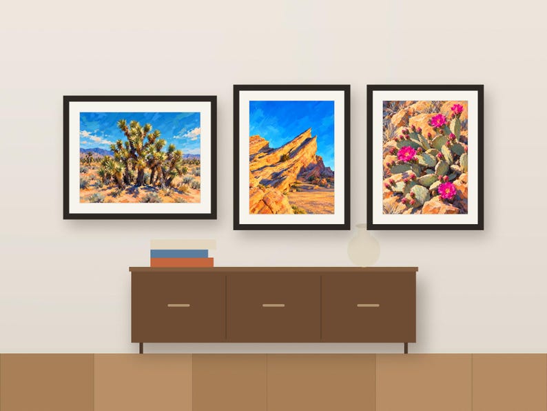 Three Desert paintings framed in a row above a wooden sideboard, shown as a room mockup