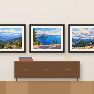 Three hiker paintings framed in a row above a wooden sideboard, shown as a room mockup
