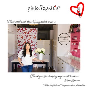May include: A woman stands in a shop with white walls and a heart-shaped wallpaper. She is smiling and looking at the camera. The shop has a white counter and shelves with various items. The text "philo Sophie's" is visible on a sign in the shop. The text "Thank you for shopping my small business. Love, Joanna" is visible at the bottom of the image.
