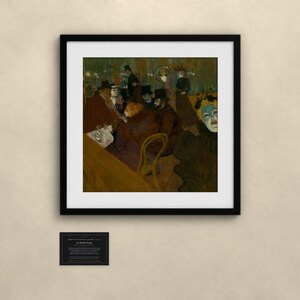 May include: A framed print of the painting At the Moulin Rouge by Henri de Toulouse-Lautrec, featuring a group of people in a dimly lit cafe setting with dark tones, a prominent figure with a pale blue face, and a small informational plaque below.