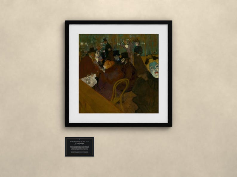 May include: A framed print of the painting At the Moulin Rouge by Henri de Toulouse-Lautrec, featuring a group of people in a dimly lit cafe setting with dark tones, a prominent figure with a pale blue face, and a small informational plaque below.