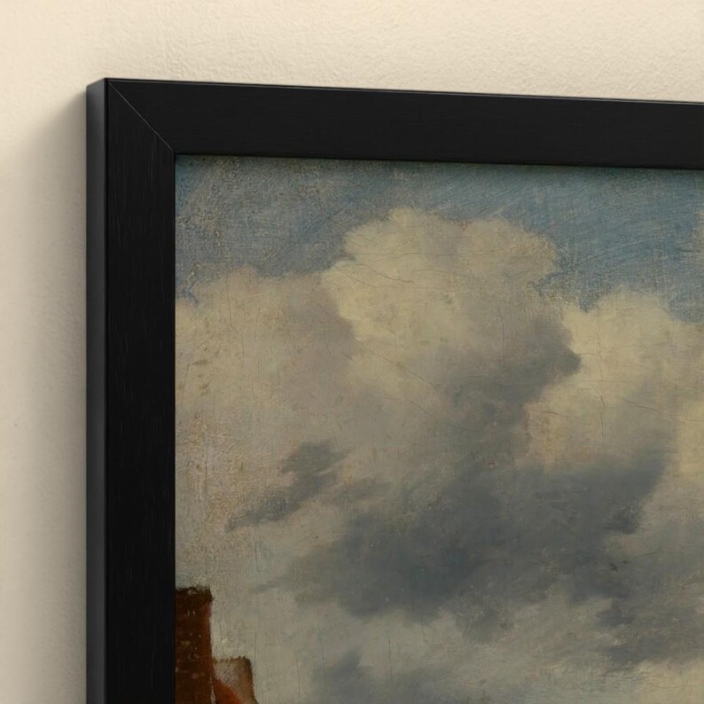May include: A framed oil painting print featuring a cloudy blue sky with soft white and gray cumulus clouds. The artwork is enclosed in a simple, flat black frame that borders the top and left edges of the canvas, highlighting the texture.