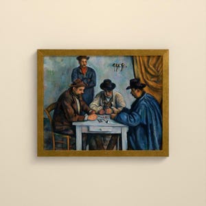May include: A framed oil painting depicting four individuals gathered around a white table. Three figures are seated, wearing hats and dark coats, while one figure stands behind them. The scene features muted blue and brown tones.