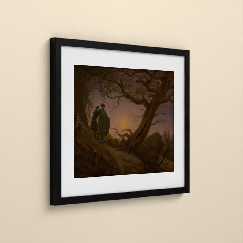May include: A framed print featuring a dark, atmospheric landscape painting of two figures standing on a rocky path beneath a gnarled, leafless tree. A thin crescent moon glows in the twilight sky above a distant, shadowy forest horizon.