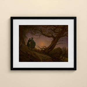 May include: A framed art print depicting two figures standing on a dark, hilly landscape under a twilight sky. A large, gnarled tree with bare branches frames the scene, while a thin crescent moon glows faintly in the distance.