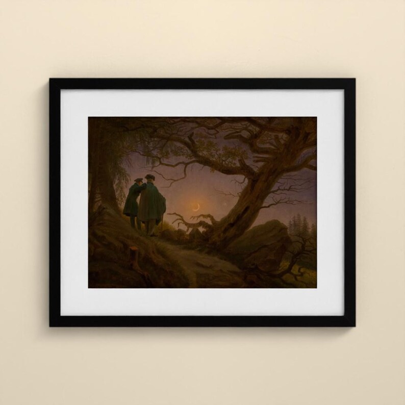 May include: A framed art print depicting two figures standing on a dark, hilly landscape under a twilight sky. A large, gnarled tree with bare branches frames the scene, while a thin crescent moon glows faintly in the distance.