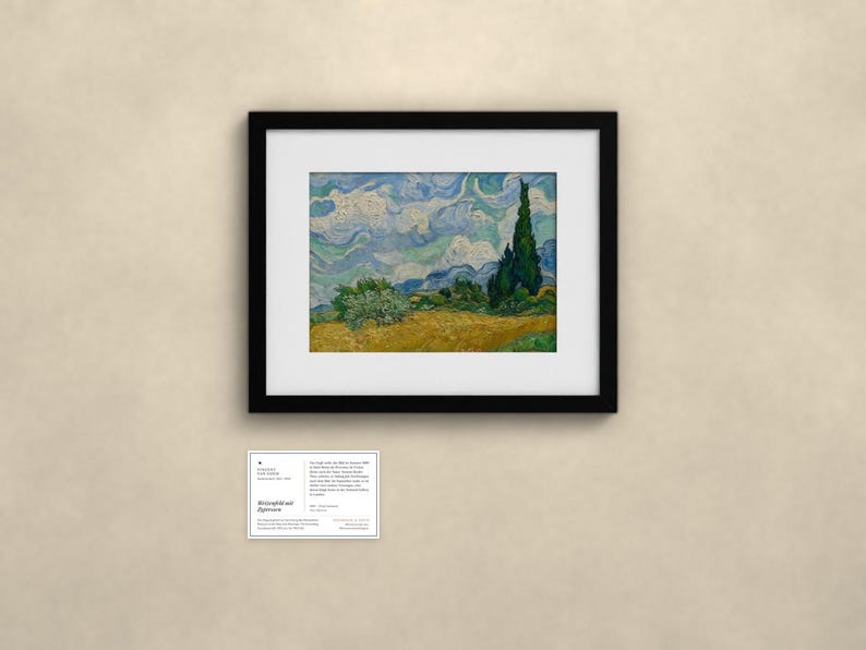 May include: A framed print of Vincent van Gogh's Wheat Field with Cypresses, featuring a golden wheat field, swirling blue sky, and dark green cypress trees. Below the artwork is a small white informational placard with black text.