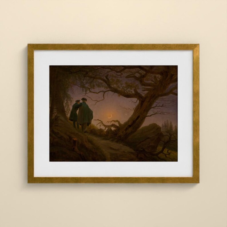 May include: A framed art print featuring a dark, atmospheric landscape painting of two figures standing on a rocky path beneath a large, gnarled tree. The scene is set at twilight with a crescent moon visible in the purple and brown sky.