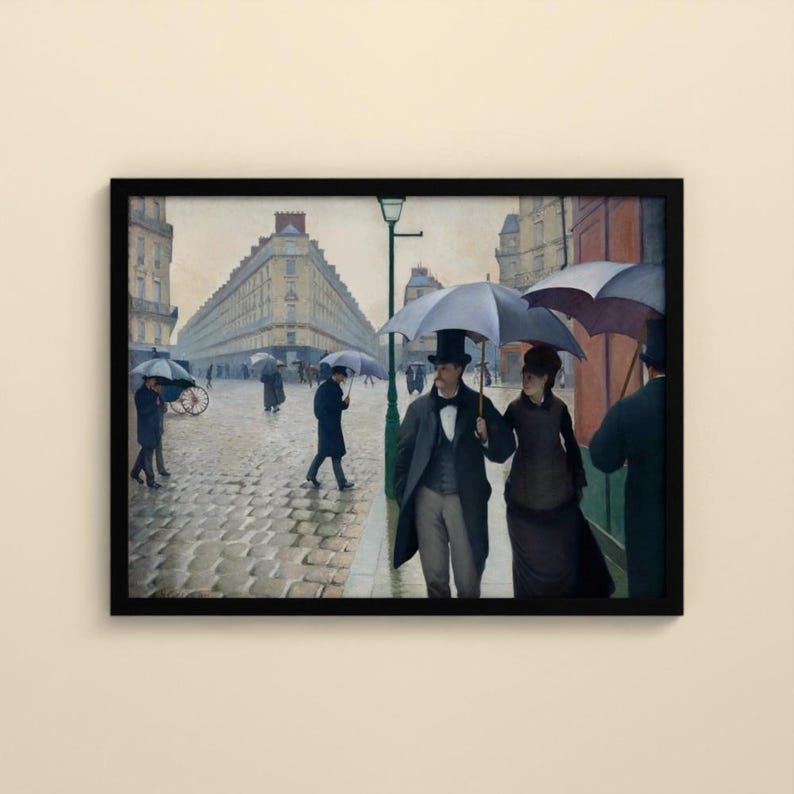 May include: A framed painting depicting a rainy Paris street scene with cobblestones. People in dark coats and top hats walk with large black umbrellas. A couple stands in the foreground, while others walk in the distance near a tall building.
