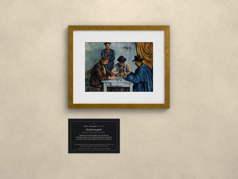 May include: A framed art print of Paul C&eacute;zanne's The Card Players, depicting four figures seated at a table playing cards. Below the gold-framed print is a black informational plaque with white text detailing the artwork's history and provenance.