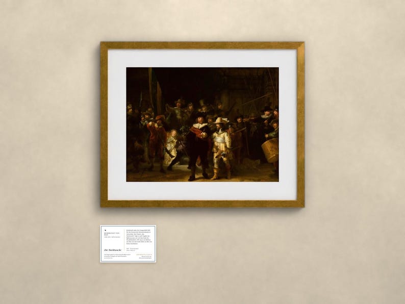 May include: A framed print of Rembrandt's The Night Watch, featuring a group of figures in dark clothing with highlights of red and yellow, set within a gold frame and white mat, accompanied by a small informational plaque below the artwork.