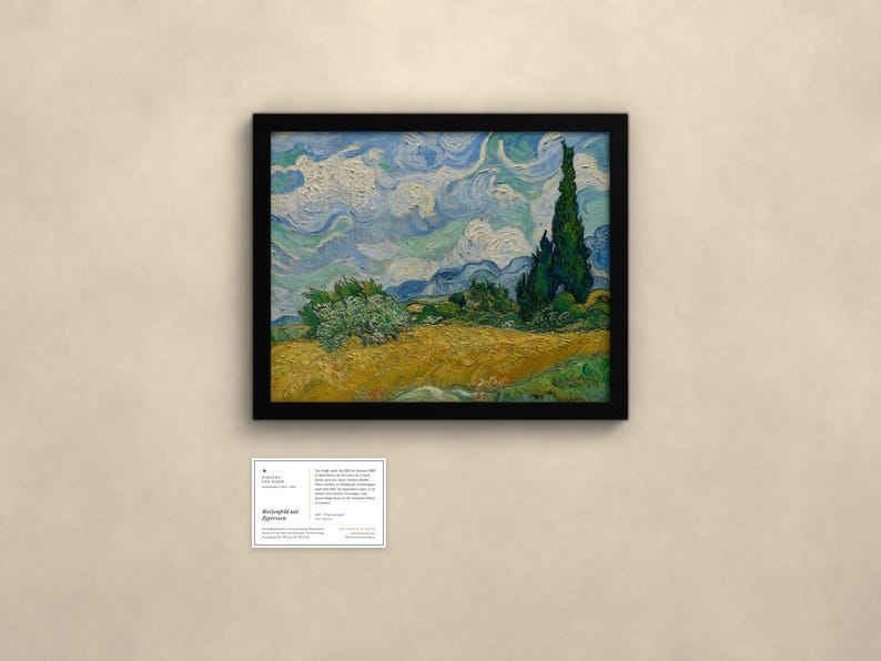 May include: A framed oil painting featuring a golden wheat field under a swirling blue sky with a tall dark green cypress tree on the right. Below the painting is a small white informational placard with black text detailing the artwork.