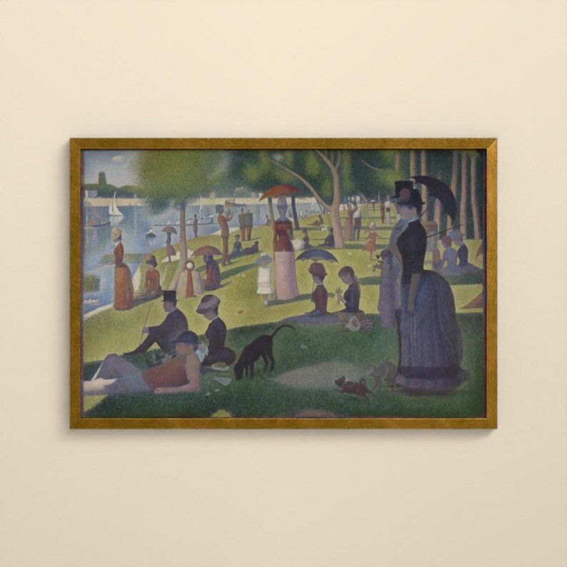 May include: A framed print of a pointillist painting depicting a park scene by a river. Numerous figures in period clothing are scattered across a green lawn, some holding umbrellas or parasols. A black dog stands near the center foreground.