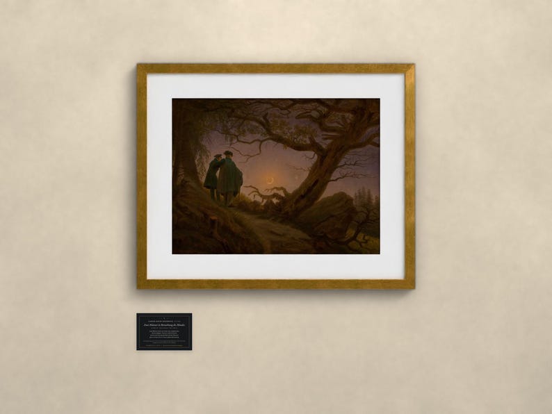May include: A framed art print featuring a dark, moody landscape painting of two figures standing under a large, gnarled tree at twilight. The scene includes a crescent moon in the sky and a small black plaque below the frame with white text.