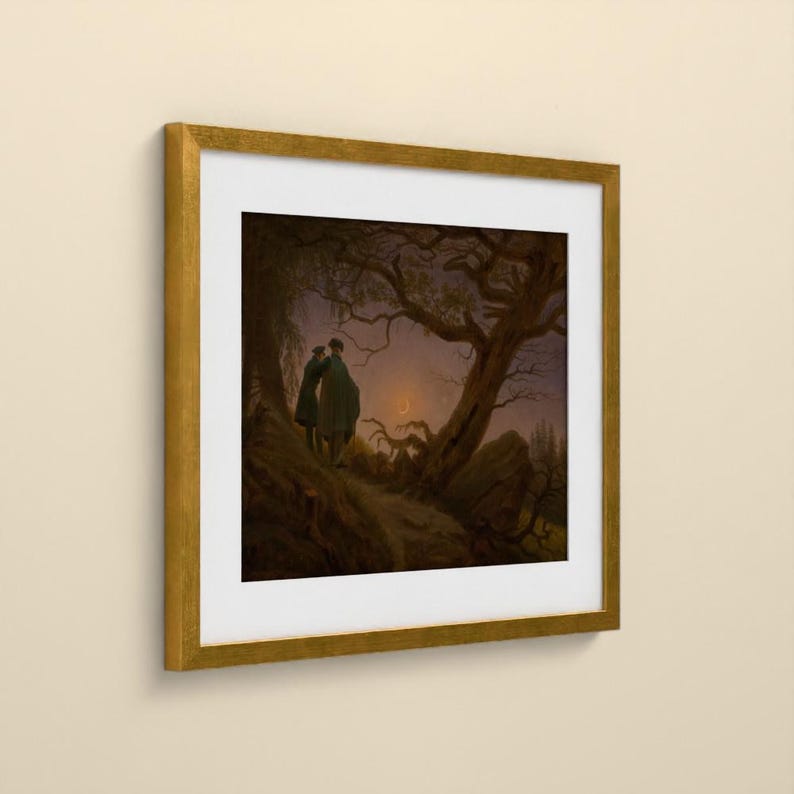 May include: A framed art print featuring a dark, atmospheric landscape painting of two figures standing under a large, gnarled tree at twilight. A thin crescent moon is visible in the sky. The artwork is enclosed in a square gold frame with a white mat.