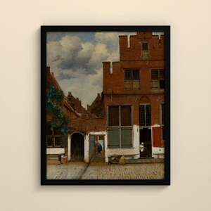 May include: A framed oil painting depicting a Dutch courtyard scene with red brick buildings, green shutters, and a cobblestone ground. Figures are visible in the doorways under a cloudy sky, with a climbing plant on the left wall.