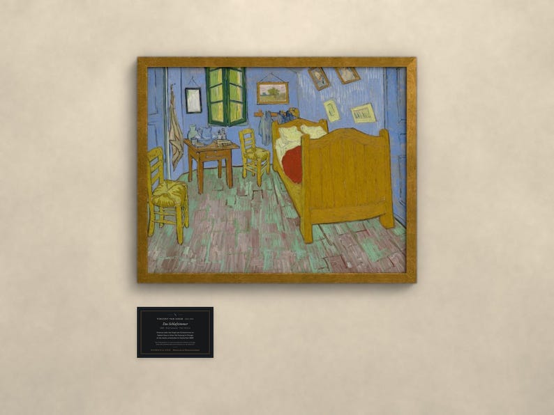 May include: A framed print of Vincent van Gogh's Bedroom in Arles painting, featuring a yellow bed, two wooden chairs, and a small table in a blue room. Below the artwork is a black rectangular plaque with white text detailing the piece.