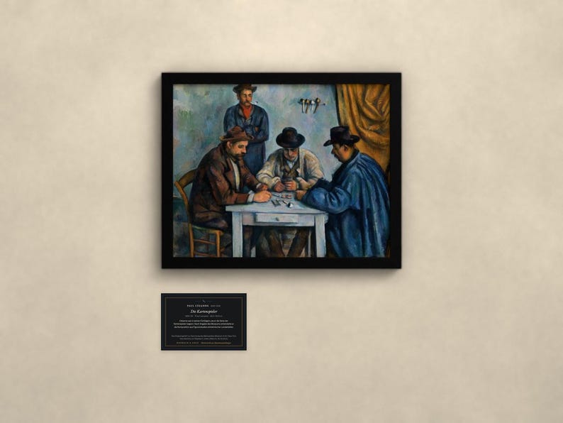 May include: A framed print of Paul C&eacute;zanne's painting The Card Players, depicting four men around a table. Below the frame is a black plaque with white text reading Paul C&eacute;zanne, 1890-1892, Die Kartenspieler, and descriptive information.