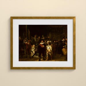 May include: A framed art print of Rembrandt's The Night Watch, featuring a group of figures in dark, dramatic clothing with highlights of red, yellow, and white. The painting is encased in a gold-toned frame with a white mat border.