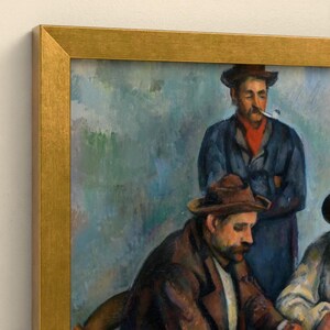 May include: A framed oil painting print featuring two men in hats, one wearing a dark blue coat and smoking a pipe, the other in a brown jacket. The artwork is enclosed in a metallic gold frame with a clean, angled edge profile.
