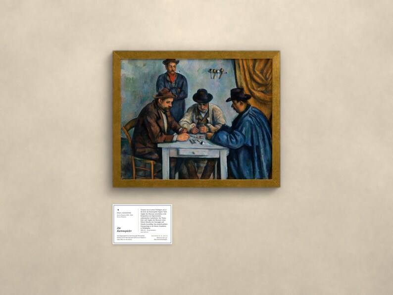 May include: An oil painting in a gold frame depicting four individuals seated around a white table playing cards. Three figures wear hats and dark coats, while one stands behind them. A small white informational plaque is mounted below the artwork.