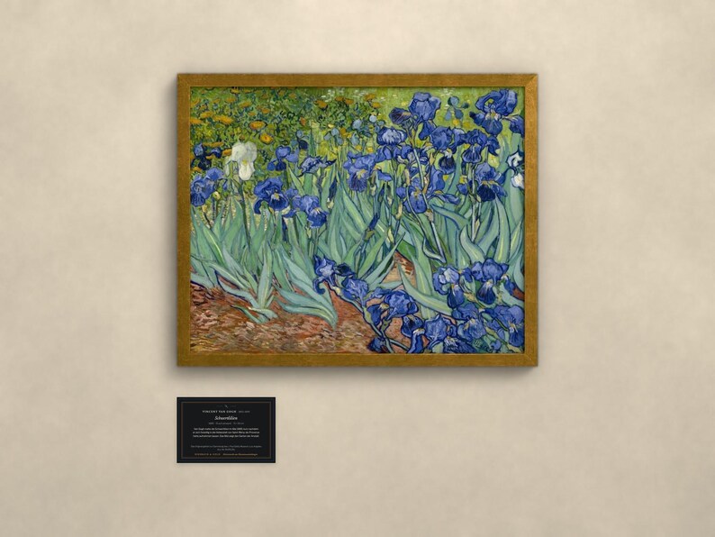 May include: A framed print of Vincent van Gogh's Irises painting, featuring deep blue flowers with green foliage and a single white iris. The artwork is enclosed in a gold-toned frame and accompanied by a small black informational plaque below.