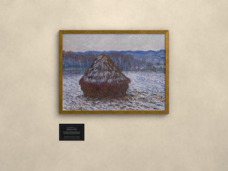 May include: A framed painting of a dark brown haystack in a snowy field under a pale sky, with blue hills in the distance. Below the frame is a small black plaque with white text reading CLAUDE MONET, Meules en Hiver, 1891, Oil on canvas.