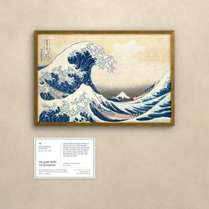 May include: A framed print of The Great Wave off Kanagawa featuring a large blue wave, white foam, and Mount Fuji in the background. Below the print is a rectangular information card with black text detailing the artwork's history.