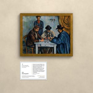 May include: A framed oil painting titled The Card Players by Paul C&eacute;zanne, depicting three men seated at a table playing cards, with a fourth man standing behind them. Below the painting is an informational placard with German text.