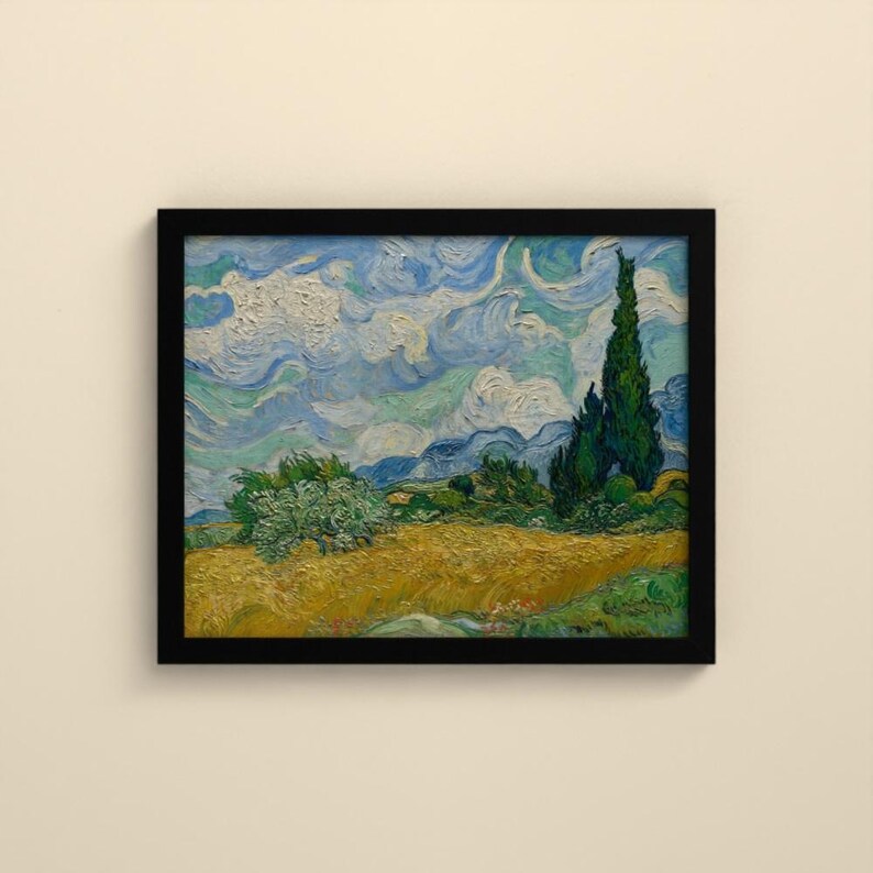May include: A framed oil painting print featuring a golden wheat field under a swirling blue and white sky. A tall, dark green cypress tree stands on the right side, while a smaller, rounded green bush sits in the center of the field.
