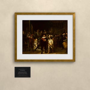 May include: A framed print of Rembrandt's The Night Watch, featuring a group of figures in dark, dramatic lighting. The artwork is enclosed in a gold-toned frame with a white mat. Below the frame is a small black plaque with white text.