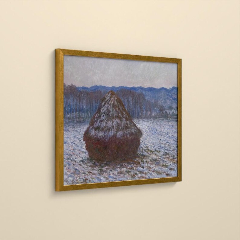 May include: A framed painting depicting a dark brown haystack centered in a snowy field under a pale sky. The landscape features blue-toned trees and distant hills in the background, all enclosed within a simple, thin gold-colored frame.