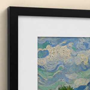 May include: A framed art print featuring a textured oil painting of a swirling sky with thick, visible brushstrokes in shades of blue, white, and light green. The artwork is encased in a simple black frame with a wide white mat border.