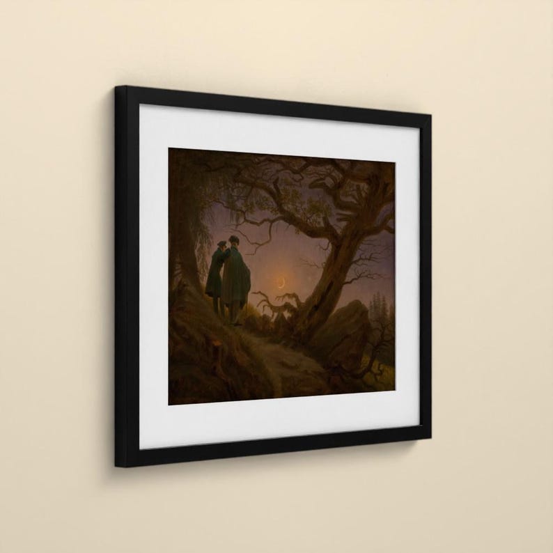 May include: A framed print featuring a dark, atmospheric landscape painting of two figures standing on a rocky path beneath a gnarled, leafless tree. A thin crescent moon glows in the twilight sky above a distant, shadowy forest horizon.