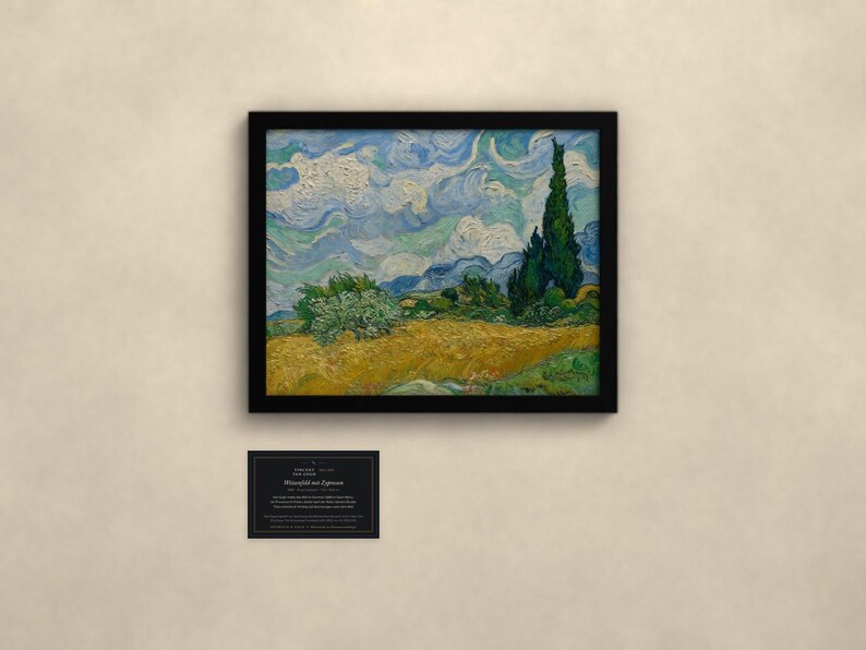 May include: A framed print of Vincent van Gogh's Wheat Field with Cypresses, featuring a golden wheat field, dark green cypress trees, and a swirling blue sky. Below the frame is a small black informational card with white text.