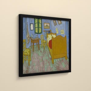 May include: A framed print of Vincent van Gogh's Bedroom in Arles painting, featuring a yellow bed, two yellow chairs, a wooden table, and blue walls. The artwork displays a perspective of a bedroom interior with various framed pictures on the wall.
