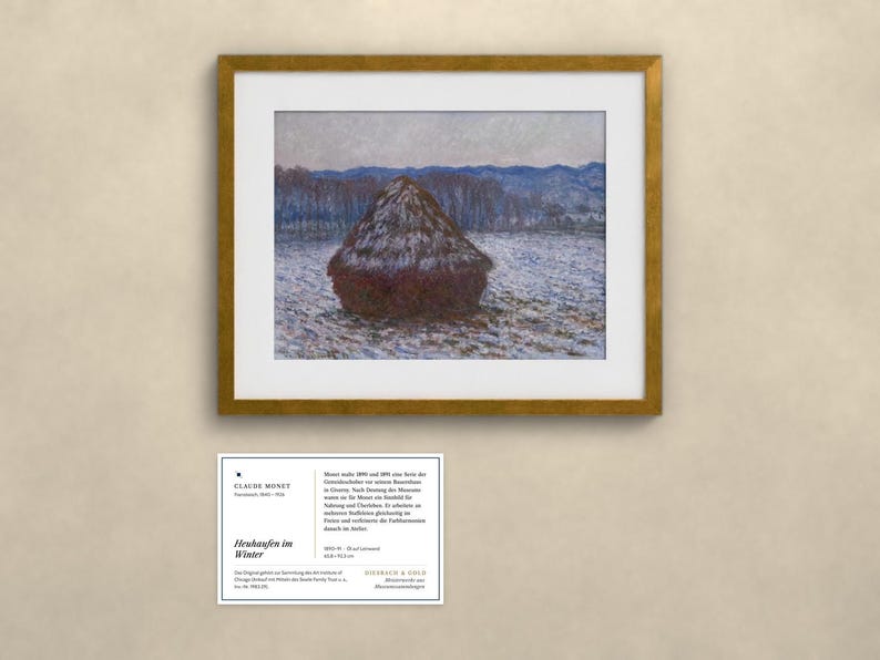 May include: A framed print of Claude Monet's painting Heubaufen im Winter, featuring a dark haystack in a snowy field with blue hills in the background. Below the frame is an informational card with text about the artwork and the artist.