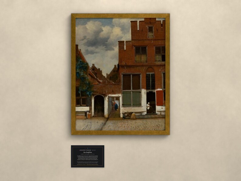 May include: A framed oil painting depicting a Dutch street scene with red brick buildings, a cobblestone courtyard, and a cloudy sky. The artwork features architectural details including multi-paned windows and a small doorway. A black informational plaque is below.