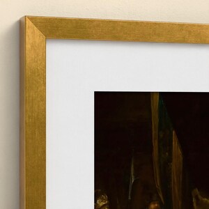 May include: A rectangular wall art piece featuring a dark, classical oil painting enclosed within a metallic gold frame. The artwork is set against a white mat board, creating a clean border between the frame and the dark, detailed imagery.