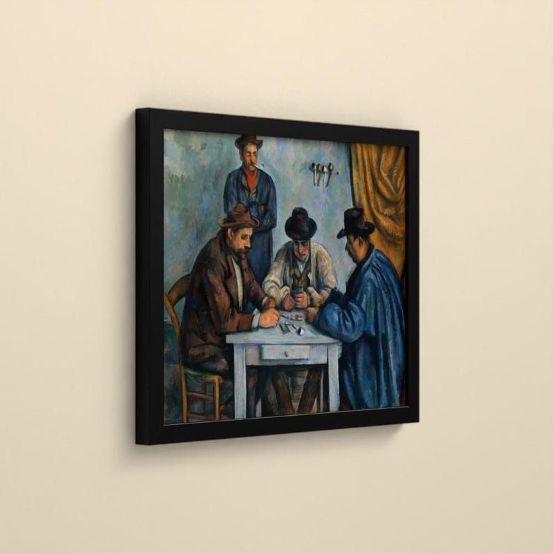 May include: A framed art print depicting a painting of four men gathered around a small white table. Three men are seated, wearing hats and coats in shades of brown, blue, and white, while one man stands behind them in a blue uniform.