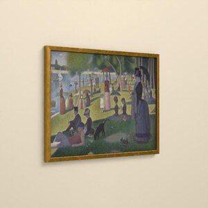 May include: A framed print of Georges Seurat's A Sunday Afternoon on the Island of La Grande Jatte, featuring numerous figures in 19th-century attire relaxing in a park by a river, rendered in a pointillist style with a gold frame.