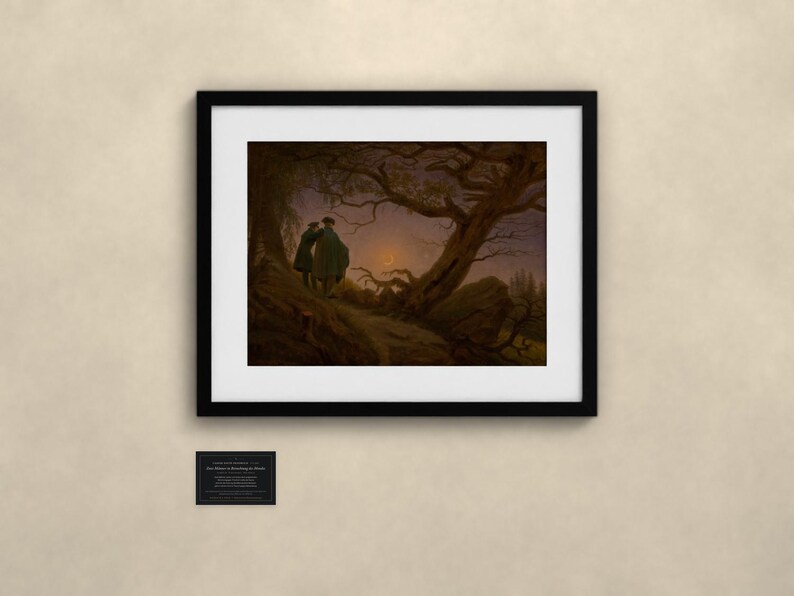 May include: A framed art print titled Two Men Contemplating the Moon, featuring a dark landscape with two figures standing on a rocky path under a large, gnarled tree, looking toward a crescent moon in a twilight sky.