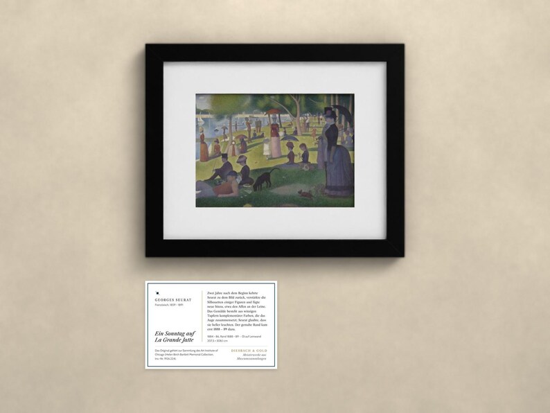 May include: A framed print of Georges Seurat's painting A Sunday on La Grande Jatte, featuring people in a park by the water, accompanied by a white informational card with black text detailing the artwork and artist.