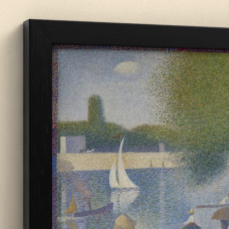 May include: A framed pointillist art print depicting a river scene with a white sailboat, lush green trees, and figures along the bank. The artwork features a textured application of small colored dots, enclosed in a simple black frame.