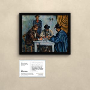 May include: A framed print of Paul C&eacute;zanne's painting The Card Players, depicting three men playing cards at a white table with a fourth man standing behind them. Below the frame is an informational placard with the title Die Kartenspieler.