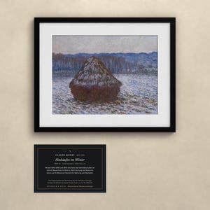 May include: A framed print of Claude Monet's Heuhaufen im Winter, depicting a dark haystack in a snowy field with blue-toned trees in the background. Below the frame is a black informational plaque with white text detailing the artwork.