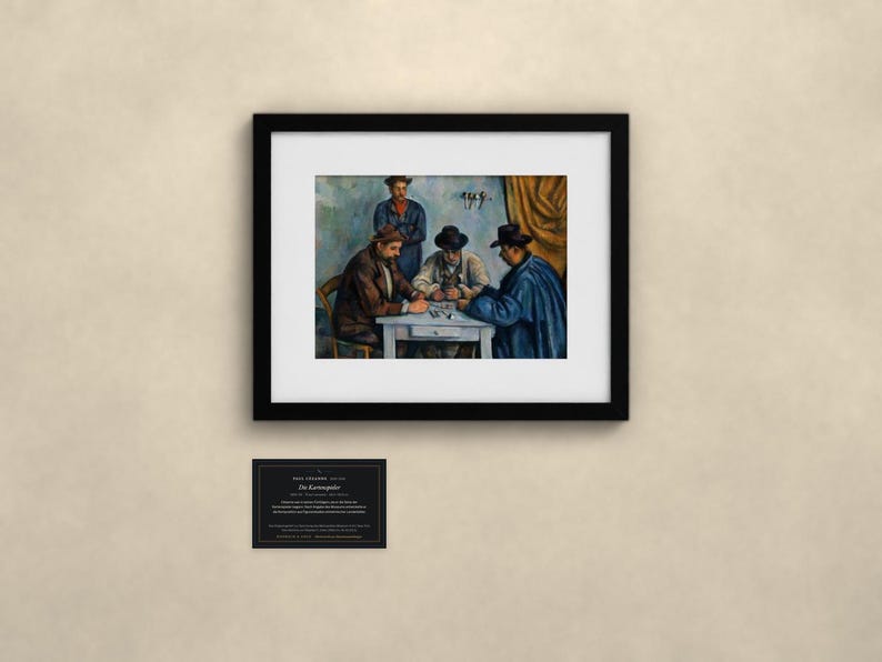 May include: A framed art print of Paul C&eacute;zanne's The Card Players, featuring four figures seated around a table playing cards. The painting is enclosed in a black frame with a white mat. Below the frame is a small black informational plaque.