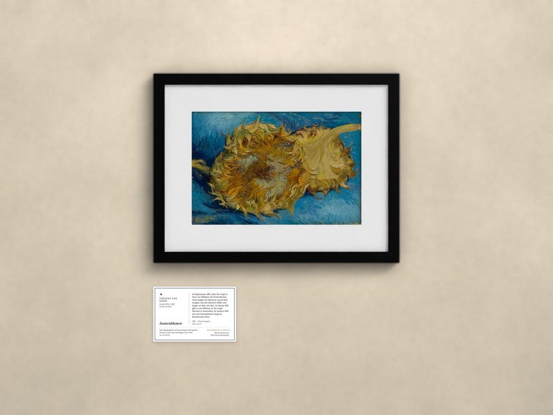May include: A framed art print featuring Vincent van Gogh's Two Cut Sunflowers painting, displayed in a black frame with a white mat. Below the frame is a small informational card with text detailing the artwork and artist history.